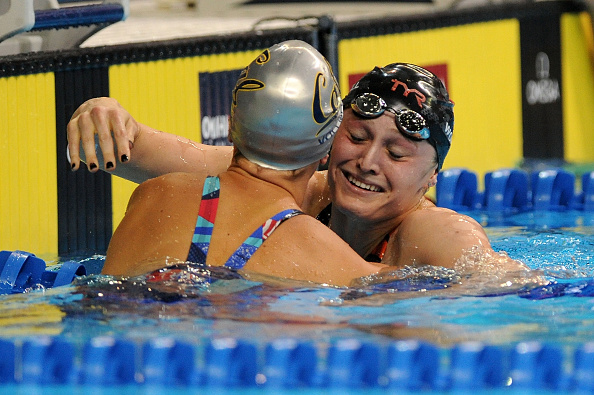 Kelsi Worrell (R) celebrates with Dana Vollmer after winning the final heat of the Women's 100 Meter Butterfly during Day 2 of the 2016 U.S. Olympic Team Swimming Trials at CenturyLink Center on June 27, 2016 in Omaha, Nebraska. (Photo by Eric Francis/Getty Images)