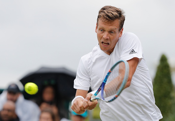 Tomas Berdych hits a backhand at Wimbledon/Getty Images