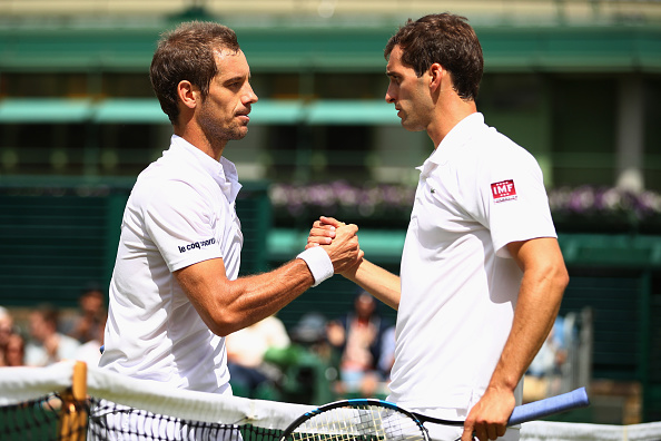 Richard Gasquet shakes hands with Albert Ramos-Vinolas following his four set win in the third round (Photo: Clive Brunskill/Getty Images)