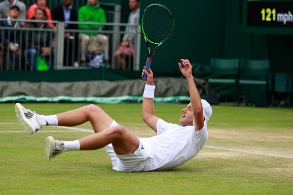 Lucas Pouille celebrates his victory over Bernard Tomic in the Round of 16 at Wimbledon/Photo: Adam Pretty/Getty Images