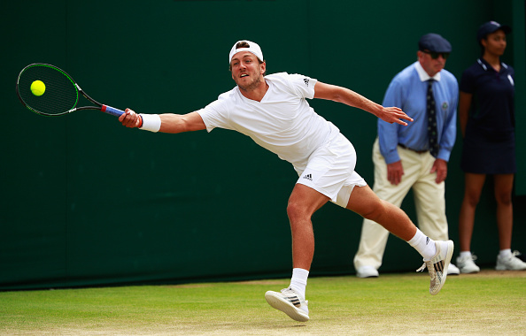 Lucas Pouille lunges for a forehand/Photo: Adam Pretty/Getty Images