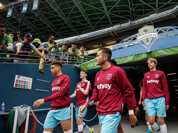 Above: West Ham United youngsters walking out ahead of the game with the Seattle Sounders | Getty Images 