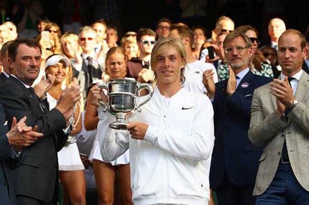 Denis Shapovalov receiving his trophy after winning the Boy's singles title at Wimbledon last year (Getty/Julian Finney)