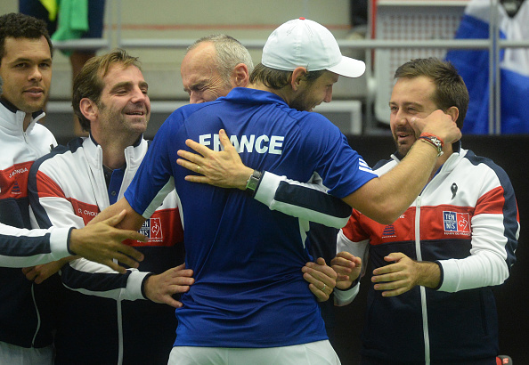 Lucas Pouille celebrates with team mates following a straight sets win in his first ever Davis Cup match (Photo: Michal Cizek/Getty Images)