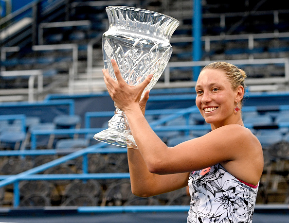 Wickmayer lifts the Citi Open trophy, the fifth title of her career. Photo credit: Grant Halverson/Getty Images.