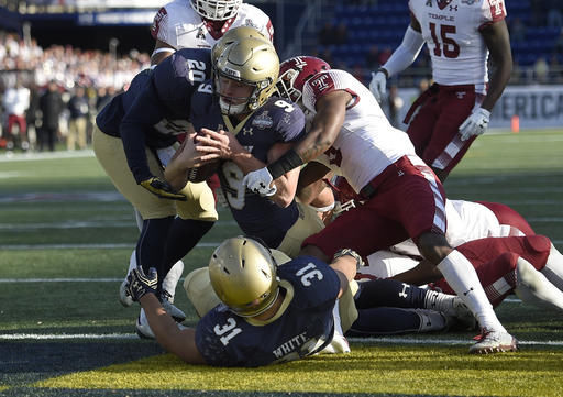 Navy backup quarterback Zach Abey lunges into the end zone for the Midshipmen's only touchdown of the game/Photo: Nick Wass/Associated Press