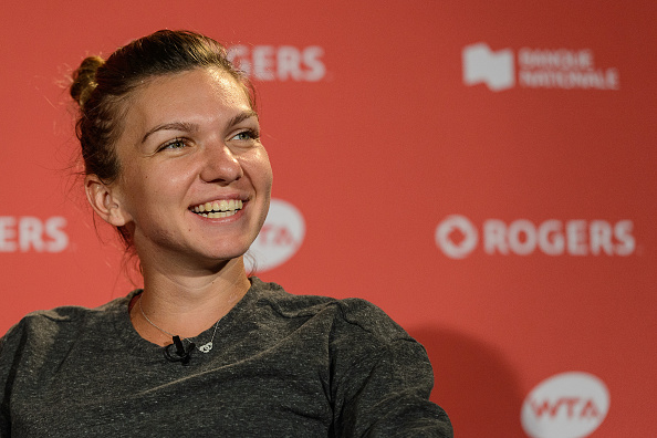 A high-spirited Halep speaks to the press after her win over Keys in the final. Photo credit: Minas Panagiotakis.