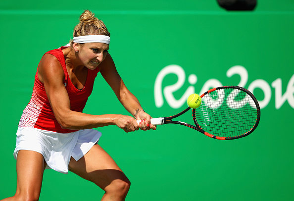Bacsinszky returns a backhand during Olympic action two weeks ago. Photo credit: Clive Brunskill/Getty Images.