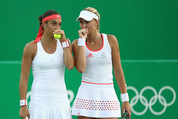 Garcia (L) had to wear another outfit in the match | Photo: Julian Finney/Getty Images