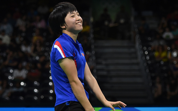 Kim smiling after one of the points in one of their entertaining rallies | Photo: Jim Watson/Getty Images