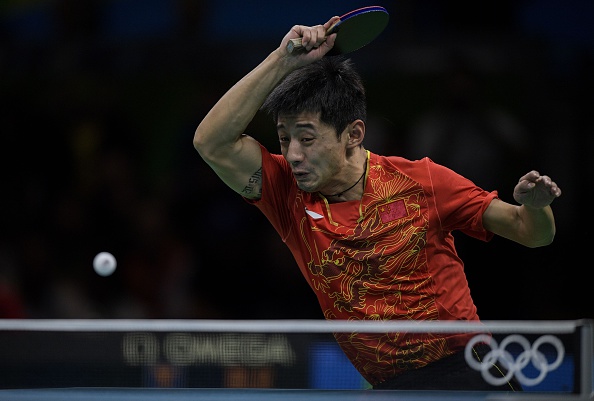 Zhang digs deep to save three game points to open up a three game lead | Photo: Juan Mabromata/Getty Images