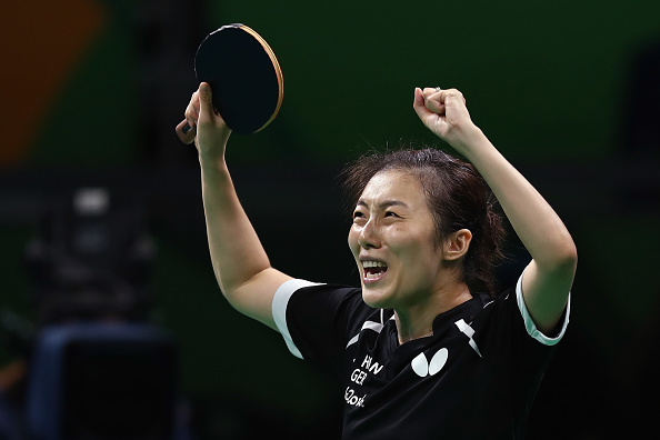 Elated Han wins it in a close finish | Photo: Lars Baron/Getty Images