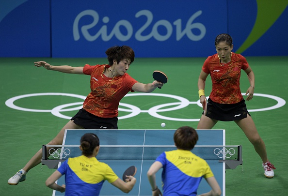 The Chinese pair were solid in the doubles | Photo: Juan Mabromata/Getty Images