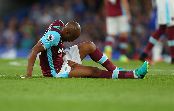 Andre Ayew lying injured on the pitch in West Ham's 2-1 defeat to Chelsea | Photo: Getty Images