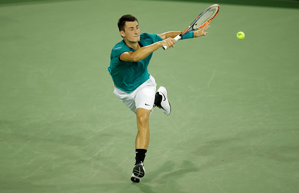 Bernard Tomic hits a forehand during his quarterfinal match at the Western & Southern Open. Photo: Getty Images / Andy Lyons
