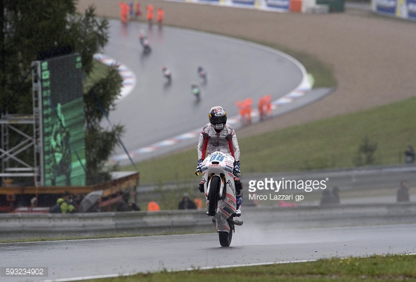 Martin celebrating second on the podium with a wheelie in the wet - Getty Images