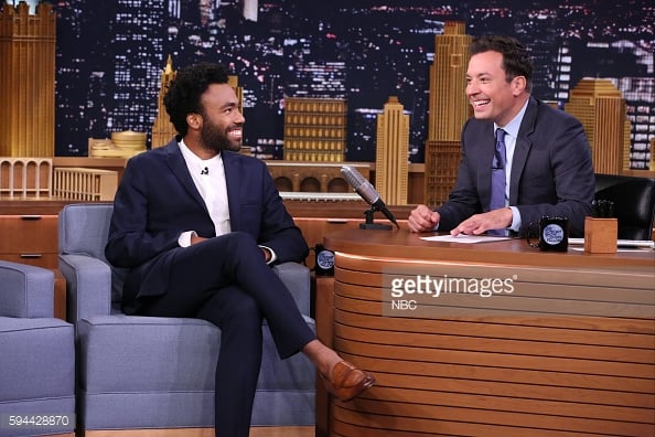 Glover sharing the love with Jimmy Fallon on The Tonight Show. Photo: Getty / NBC