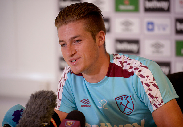 Above: Reece Burke in the pre-match press conference ahead of West Ham's match with Astra Giurgiu | Photo: Getty Images