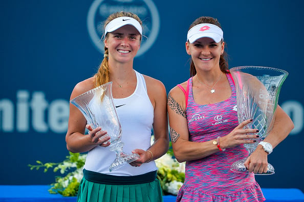 Radwanska and finalist Elina Svitolina (left) pose with their silverware after the conclusion of the final in New Haven last week. Photo credit: Alex Goodlett/Getty Images.