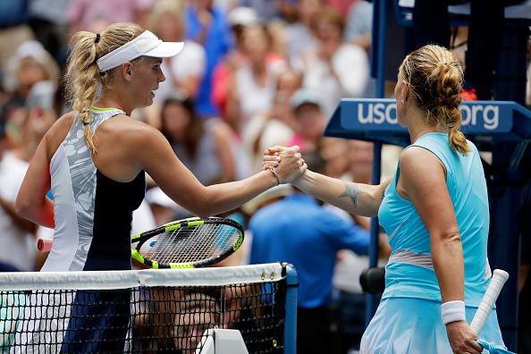 Caroline Wozniacki (L) shakes hands with Svetlana Kuznetsova (R) after their second round encounter at the US Open. ( Photo: Getty Images /  Chris Trotman )