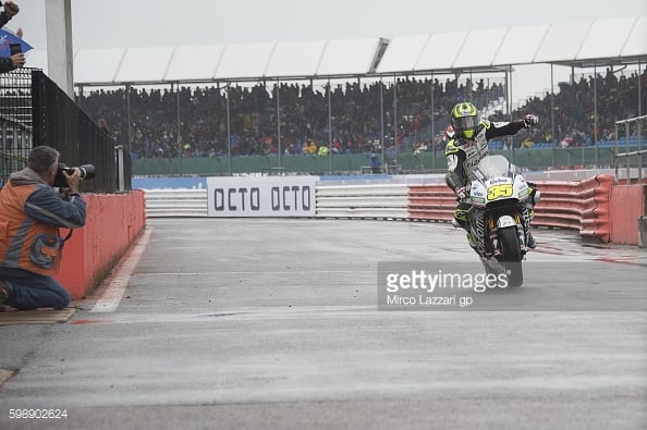 re-entering pits celebrating first MotoGP pole at his home round at Silverstone - Getty Images