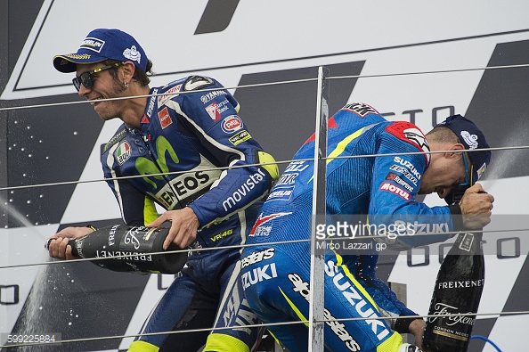 Rossi celebrating on the podium with Vinales at the British GP where the Spaniard claimed his first ever MotoGP win - Getty Images