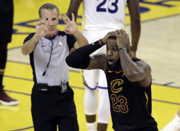 James is shocked as a foul call is reversed from a charge on Kevin Durant to a block on him/Photo: Marcio Jose Sanchez/Associated Press