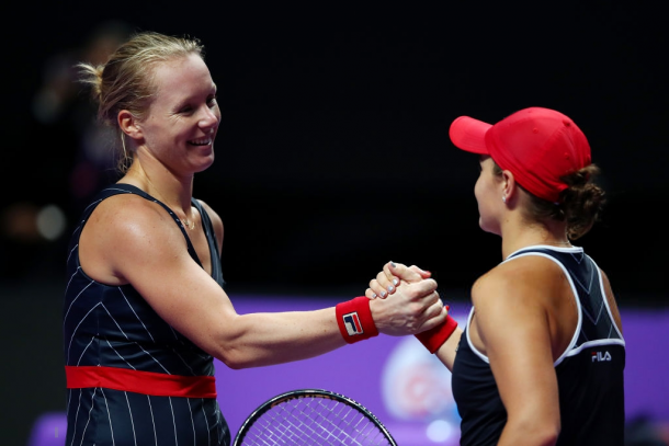 Good friends Kiki and Ashleigh meet at the net after the match | Photo: Clive Brunskill