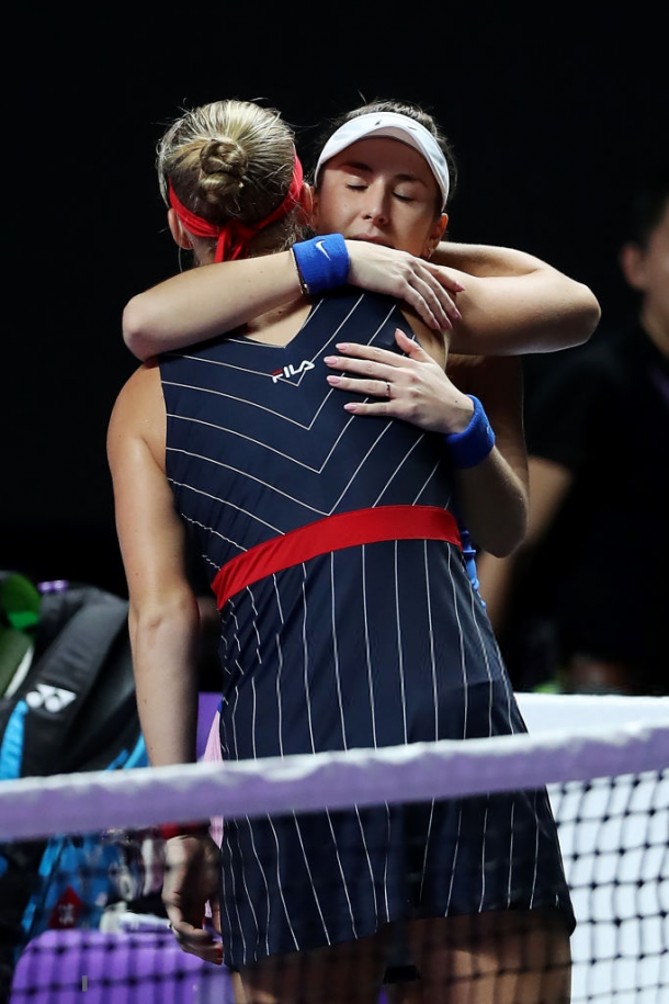 Both players share a hug after Bertens was forced to retire | Photo: Matthew Stockman