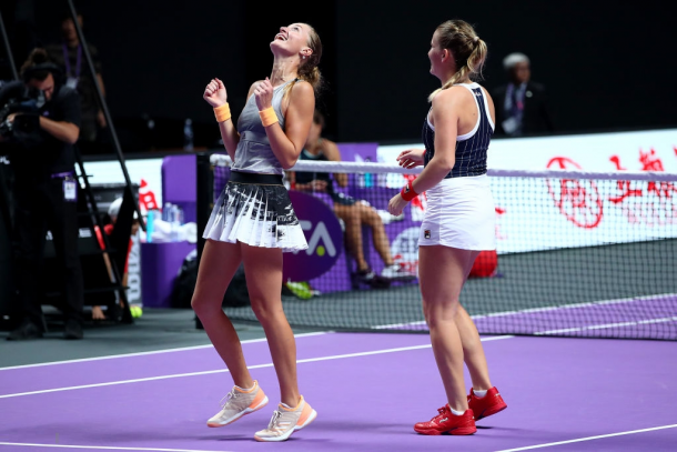 Babos and Mladenovic celebrate their win | Photo: Clive Brunskill