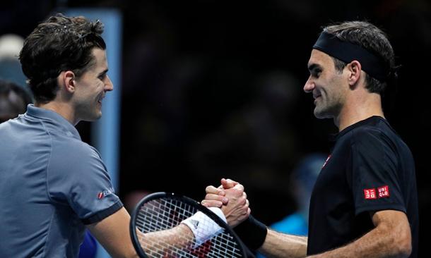 Thiem (l.) and Federer (r.) shake hands after the Austrian's victory/Photo: AFP