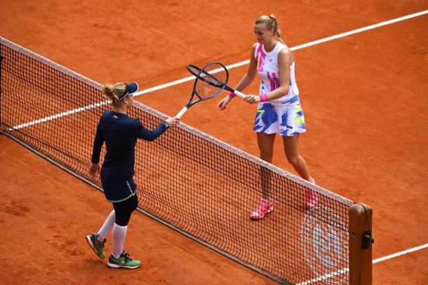 Both players tap rackets at the net after the conclusion of the match. Photo: Shaun Botterill