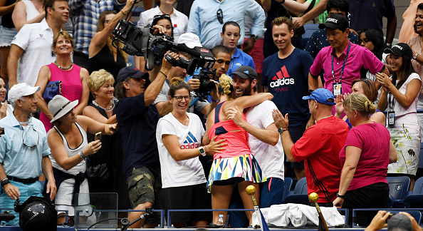 Kerber hugs coach Torben Beltz as her team celebrates after her winning the US Open. Photo credit: Mike Hewitt/Getty Images.