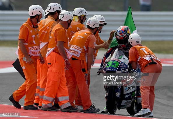 Bastianini being congratulated by the Marshals at his home circuit - Getty Images