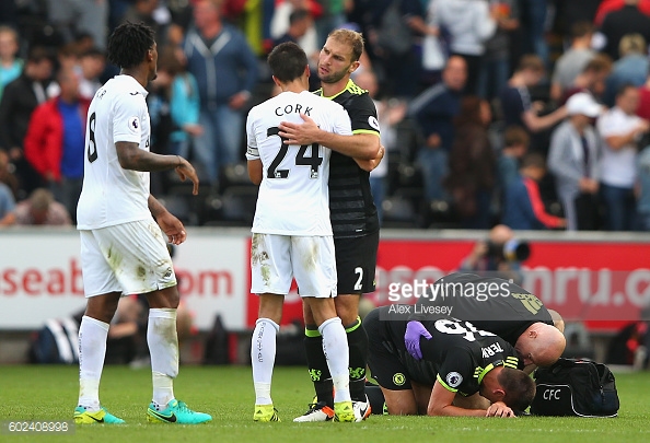 Above: John Terry laying injured during Chelsea's 2-2 draw with Swansea City | Photo: Getty Images