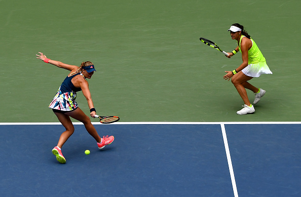 French pair get themselves the important break in the second set | Photo: Alex Goodlett/Getty Images
