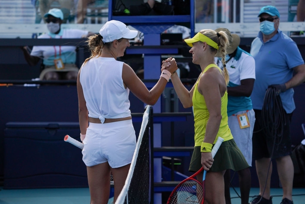 Azarenka and Kerber meet at the net after the conclusion of their third-round encounter which Azarenka won in straight sets. Photo: Icon Sportswire