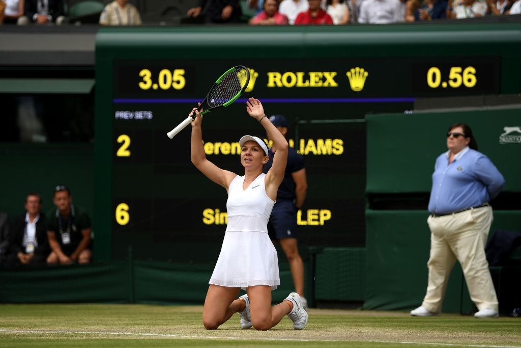 Halep gestures in celebration after a successful championship point in the 2019 Wimbledon final. Photo: Shaun Botterill