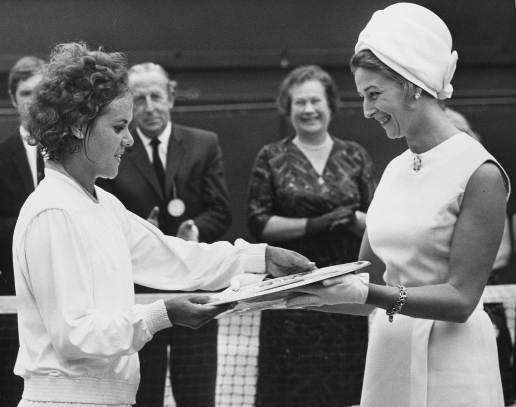 Goolagong accepts the Venus Rosewater Dish after winning Wimbledon in 1971, her first title here, a feat repeated in 2021, 50 years later, by fellow countrywoman Barty. Photo: Douglas Miller 