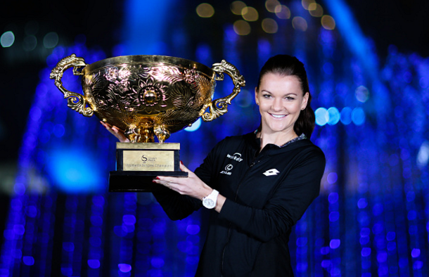 Radwanska and her trophy on the grounds of the National Tennis Centre in Beijing after her triumph in the final. Photo credit: VCG/Getty Images.