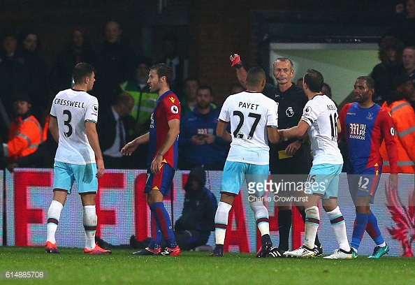 Above: Aaron Cresswell receiving his red card in West Ham's 1-0 win over Crystal Palace | Photo: Getty Images 