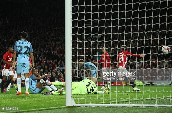 Above: Juan Mat putting the ball into the net during Manchester United's 1-0 defeat of Manchester City | Photo: Getty Images