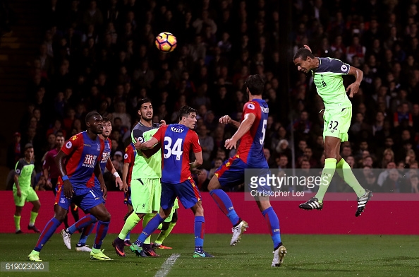 James Tomkins is nowhere near Joel Matip as the defender powers home a header | Photo: Getty images / Christopher Lee