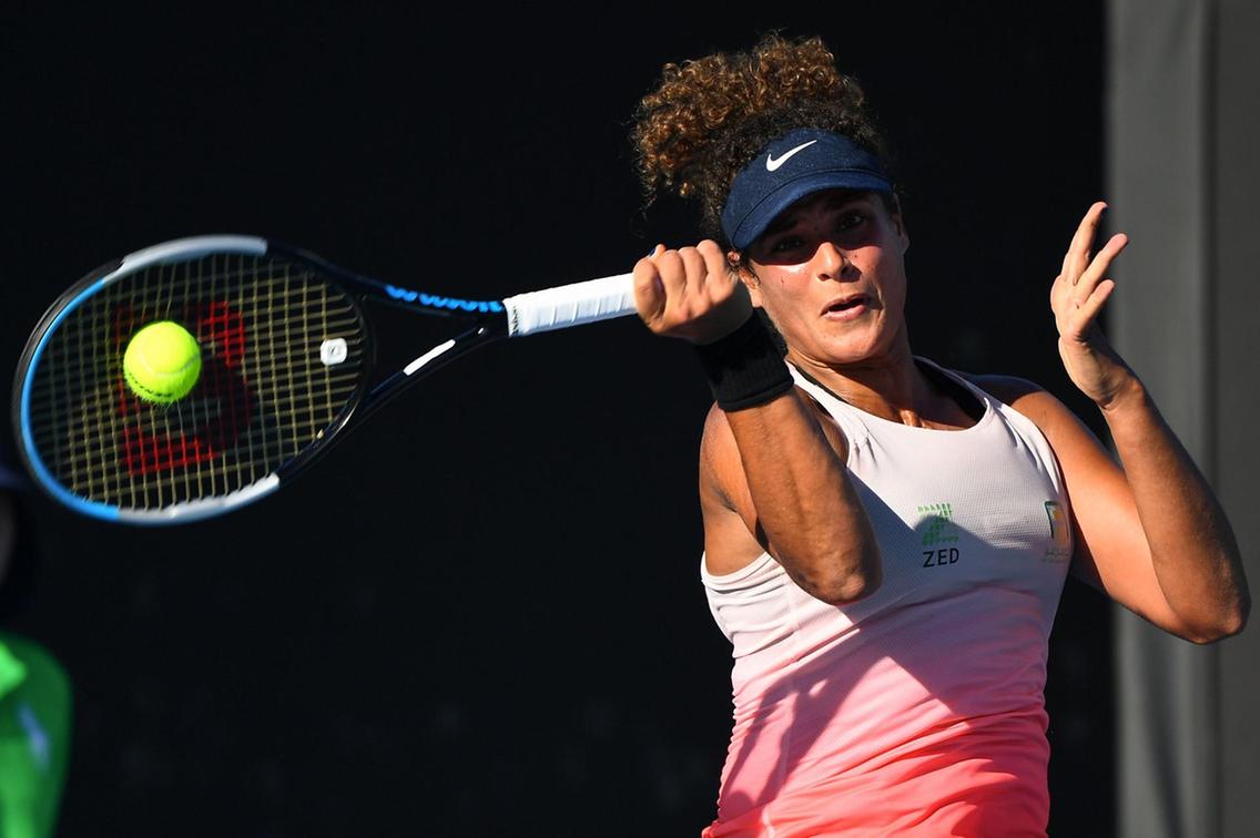 Sherif hits a forehand during her victory over Paquet/Photo: AFP