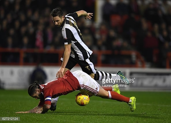 Paul Dummett takes down Henri Lansbury. (picture: Getty Images / Laurence Griffiths)