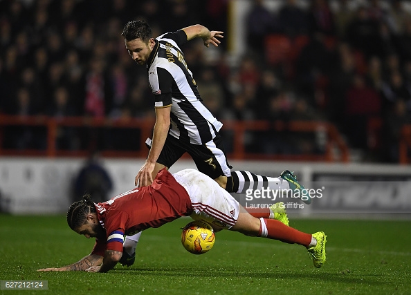 Lansbury goes down after colliding with Dummett. Photo: Laurence Griffiths/Getty