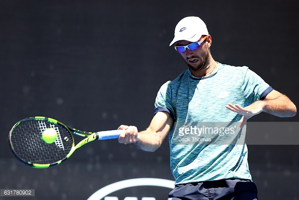 Troicki hits a forehand during his opening round match in Melbourne/Photo: Jack Thomas/Getty Images