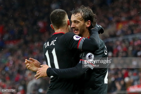 Tadic celebrates with his teammate after assisting. (Source: GettyImages)