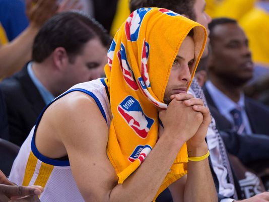 A sight we'll be seeing for potentially two weeks, Steph Curry on the bench (Kyle Terada/USA Today)