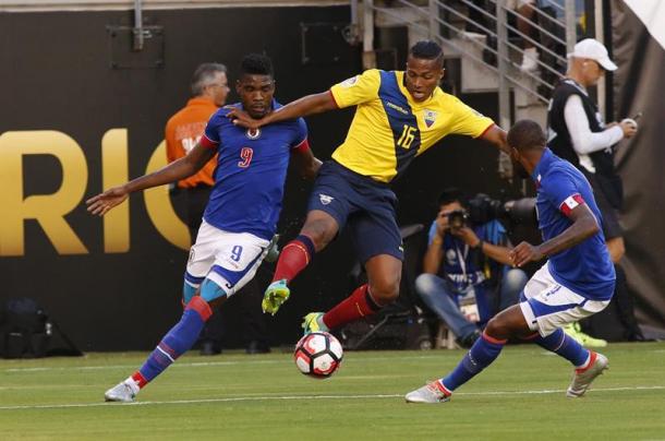 Ecuador's Antonio Valencia (Center) fighting for possession of the ball against two Haiti defenders on Sunday in their 4-0 victory. Photo provided AP. 